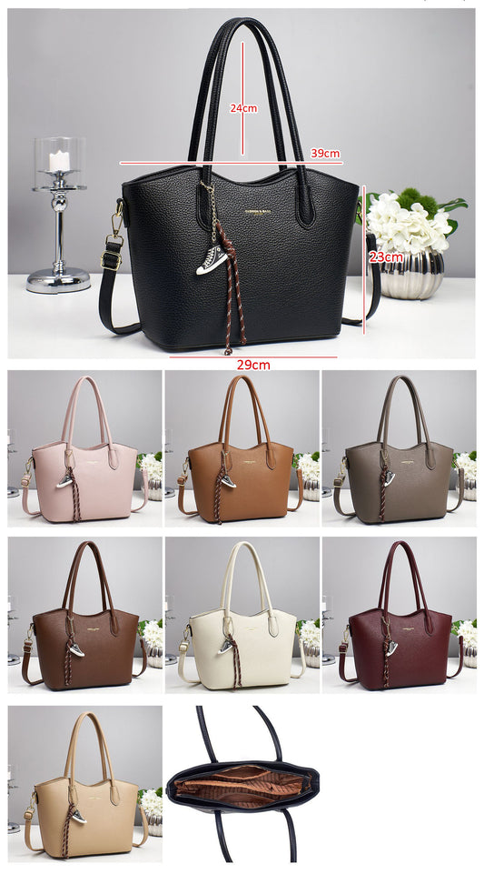 Bolso espacioso con asa superior y correa ajustable para llevarlo cruzado o al hombro