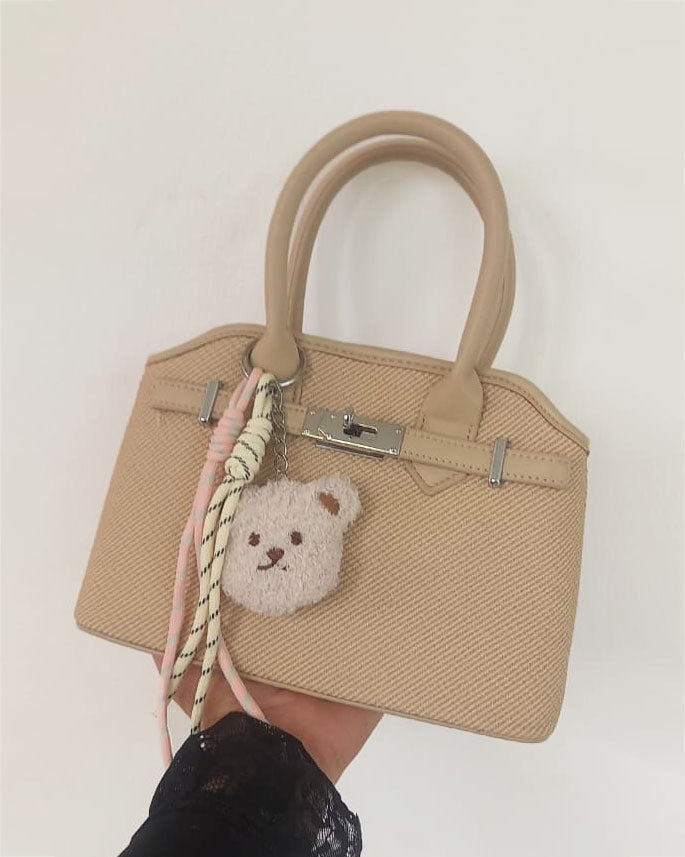 Mini cartera con cierre frontal decorativo y llavero de osito