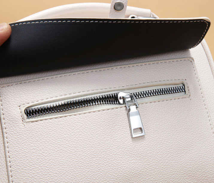 Mini cartera con tiro en tela y detalles en plateado