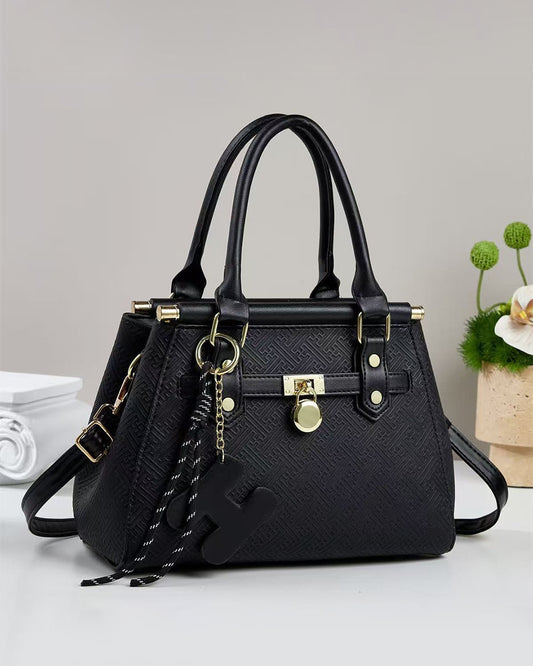 Bolso pequeño de mano con patrón geométrico grabado