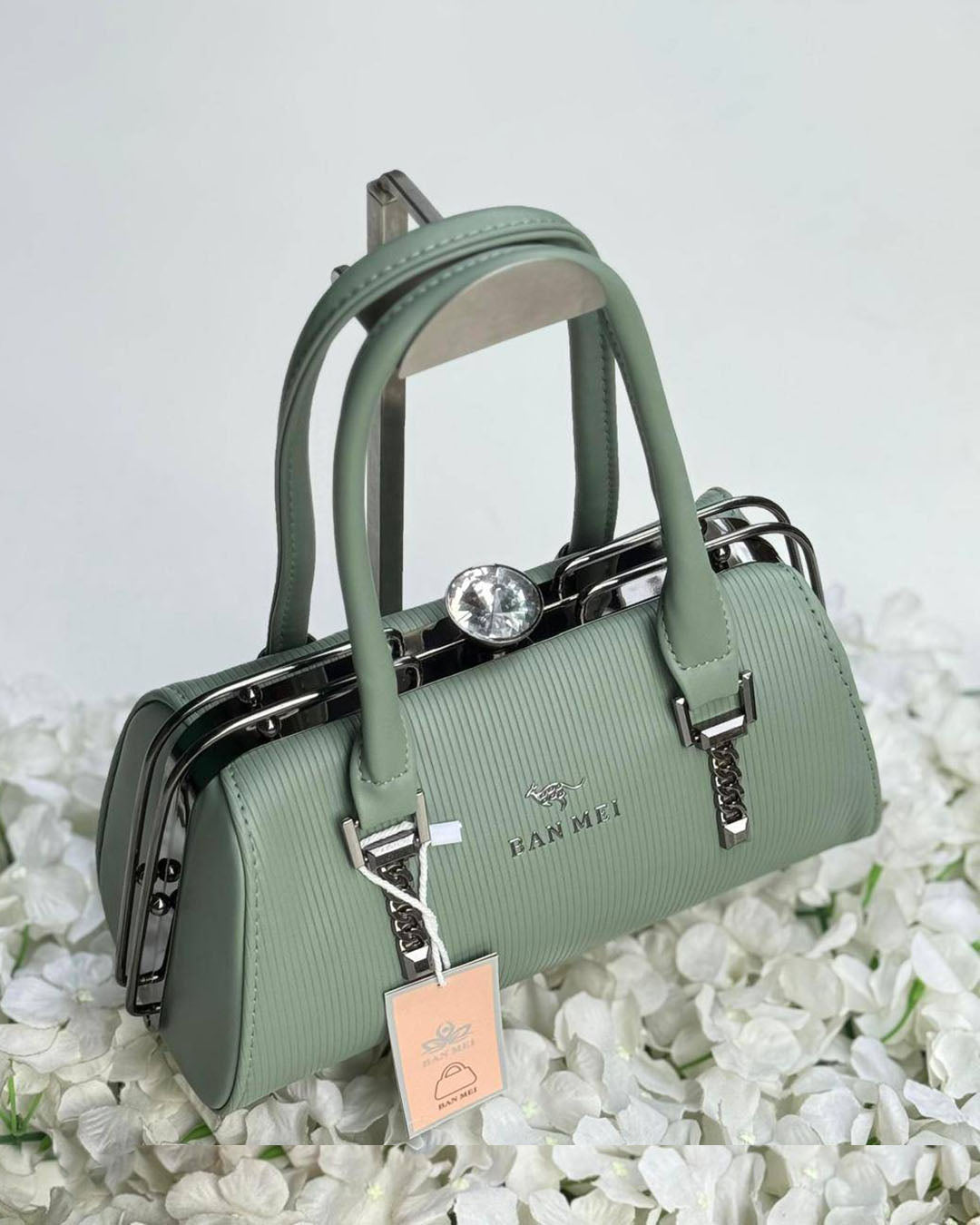 Cartera lujosa tamaño compacto, cierre superior tipo broche