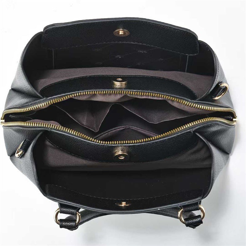 Bolso de mano y de hombro.