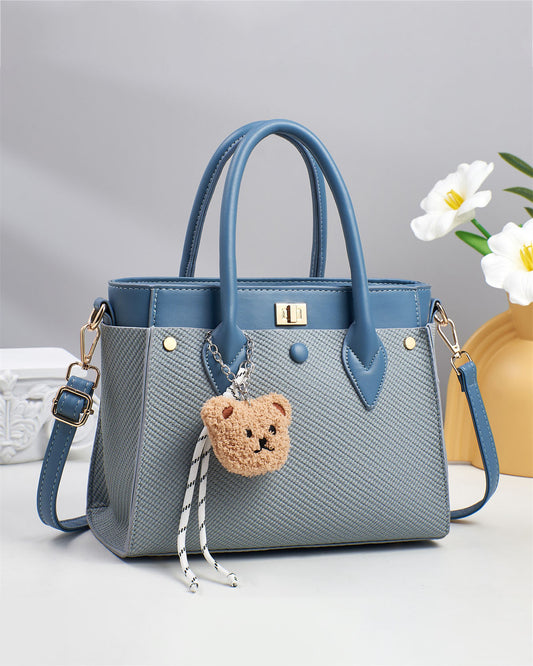 Cartera pequeña con llavero peluche removible