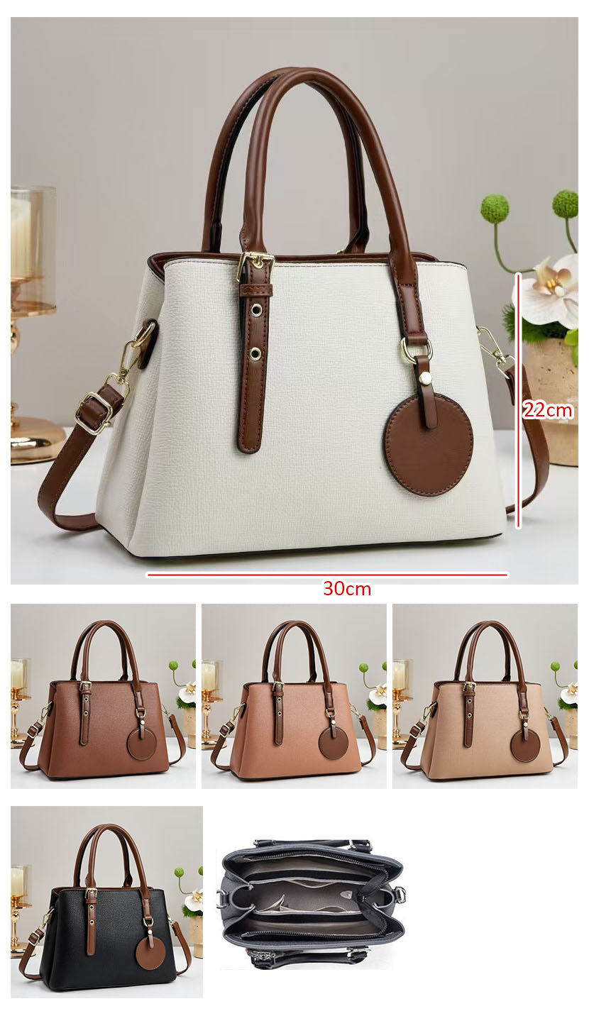 Bolso de mano con diseño de dos tonos con detalles en herrajes dorados