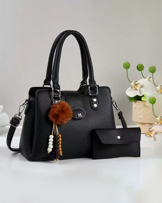 Cartera mediana con accesorio colgante y sobre libre