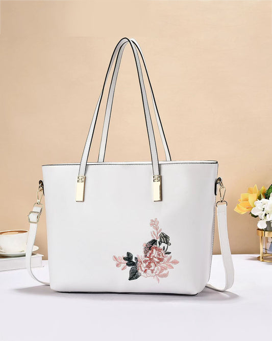 Cartera tote con detalle floral y asas largas