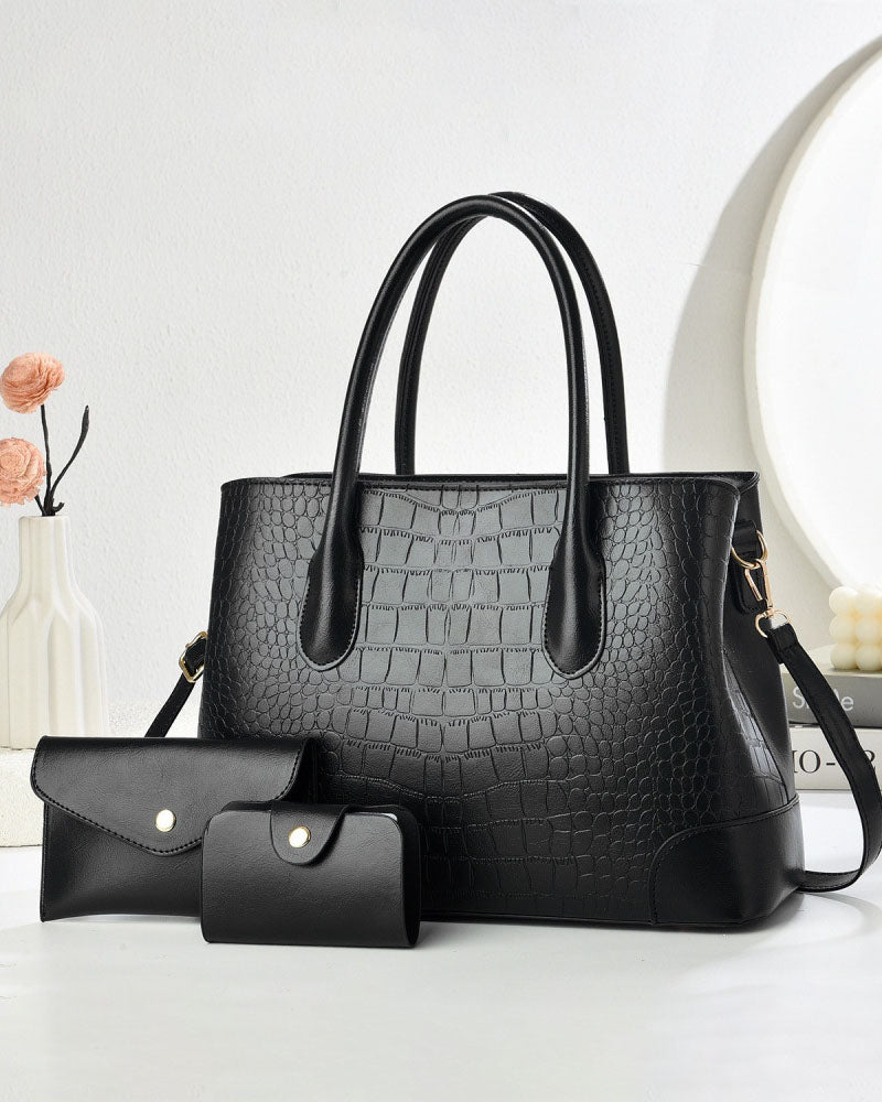 Bolso de mano en set de tres piezas con un monedero y un tarjetero a juego