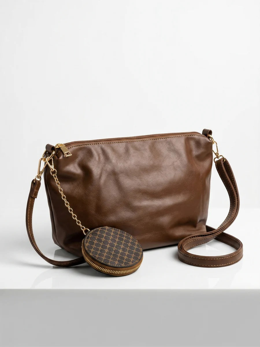 Bolso tote con patrón geométrico y un bolso de mano marrón a juego